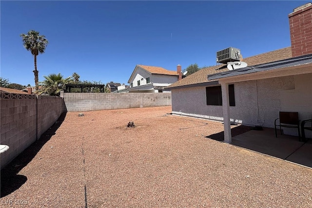 6929 Montcliff Ave, Las Vegas, NV 89147 - fenced backyard featuring a patio area and central AC