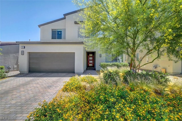 1321 Hudson Creek Pl, North Las Vegas, NV 89084 - contemporary home featuring stucco siding, decorative driveway, and an attached garage