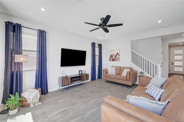 1321 Hudson Creek Pl, North Las Vegas, NV 89084 - living room with stairway, a ceiling fan, recessed lighting, wood tiled floors, and baseboards