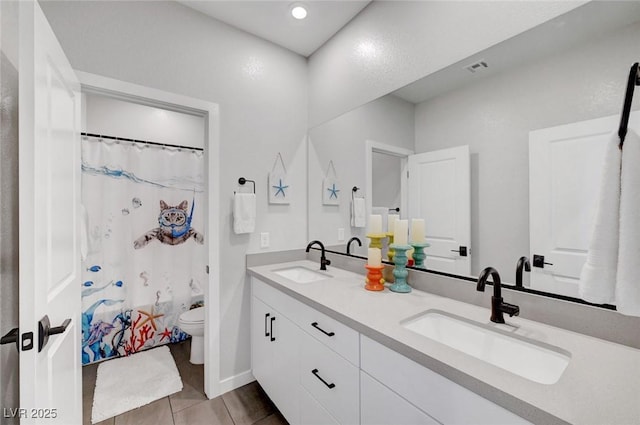 1321 Hudson Creek Pl, North Las Vegas, NV 89084 - full bath featuring double vanity, toilet, tile patterned floors, and baseboards