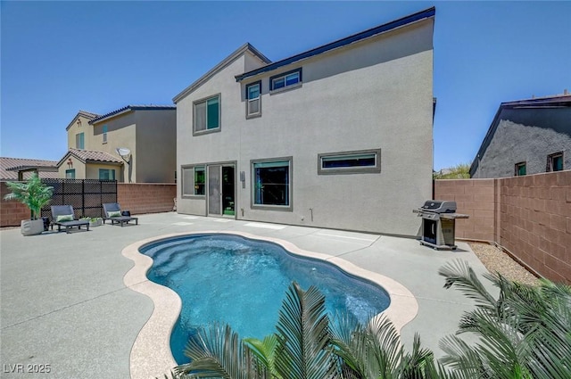 1321 Hudson Creek Pl, North Las Vegas, NV 89084 - view of swimming pool with area for grilling, a fenced backyard, and a patio