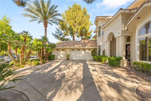 2346 Villandry Ct, Henderson, NV 89074 - view of property exterior with concrete driveway, stucco siding, and a garage