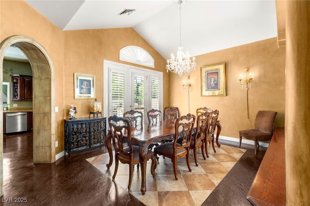 2346 Villandry Ct, Henderson, NV 89074 - dining space with baseboards, arched walkways, a chandelier, and high vaulted ceiling
