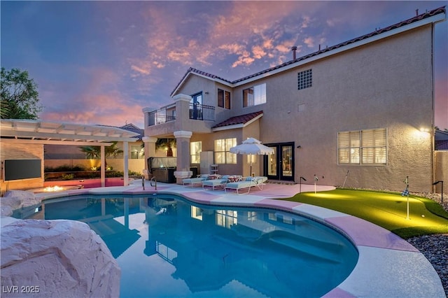 464 Beardsley Cir, Henderson, NV 89052 - outdoor pool featuring a hot tub, an area to practice putting, french doors, a pergola, and a patio area