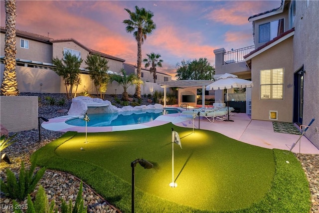 464 Beardsley Cir, Henderson, NV 89052 - view of pool featuring a putting green, a patio, and a pergola