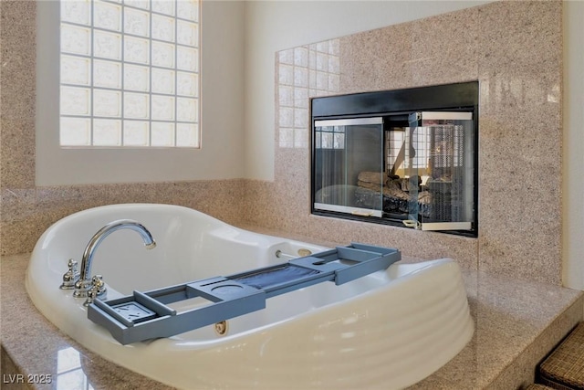 464 Beardsley Cir, Henderson, NV 89052 - full bath with a garden tub and a multi sided fireplace
