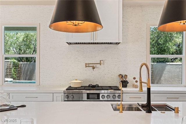 11550 Lampeter Ct, Las Vegas, NV 89138 - kitchen featuring a sink, plenty of natural light, stove, and decorative backsplash