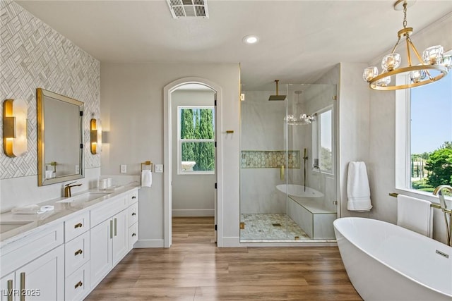 11550 Lampeter Ct, Las Vegas, NV 89138 - bathroom with a chandelier, an accent wall, a shower stall, healthy amount of natural light, and recessed lighting