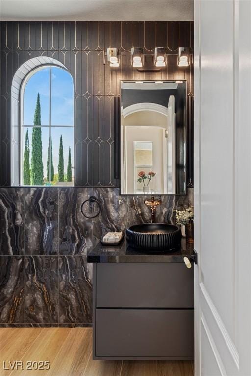 11550 Lampeter Ct, Las Vegas, NV 89138 - bathroom featuring vanity, wood finished floors, and backsplash