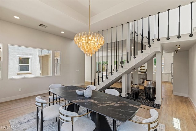 11550 Lampeter Ct, Las Vegas, NV 89138 - dining area with a chandelier, wood finished floors, baseboards, stairs, and recessed lighting