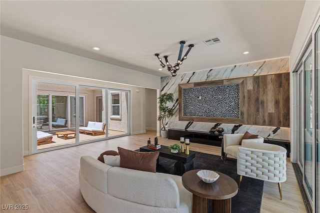 11550 Lampeter Ct, Las Vegas, NV 89138 - living area with a chandelier, light wood finished floors, baseboards, recessed lighting, and wood walls