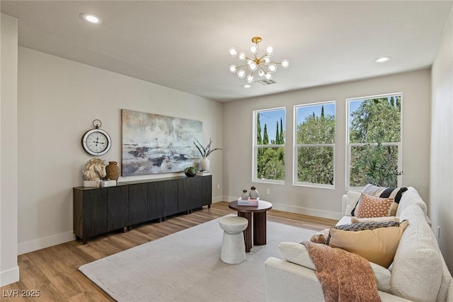 11550 Lampeter Ct, Las Vegas, NV 89138 - living area with wood finished floors, a chandelier, plenty of natural light, baseboards, and recessed lighting