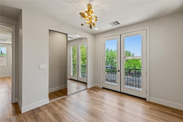 11550 Lampeter Ct, Las Vegas, NV 89138 - doorway with french doors, healthy amount of natural light, wood finished floors, and baseboards