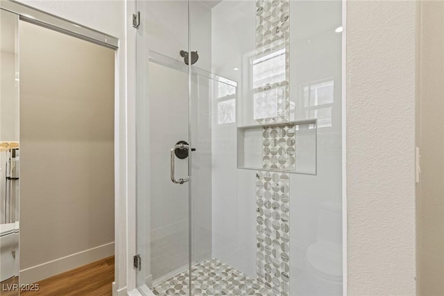 11550 Lampeter Ct, Las Vegas, NV 89138 - full bathroom with a shower stall, wood finished floors, toilet, and baseboards