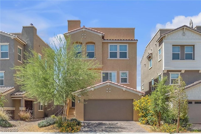 156 Campbelltown Ave, Henderson, NV 89015 - view of front of property with an attached garage, stucco siding, and driveway