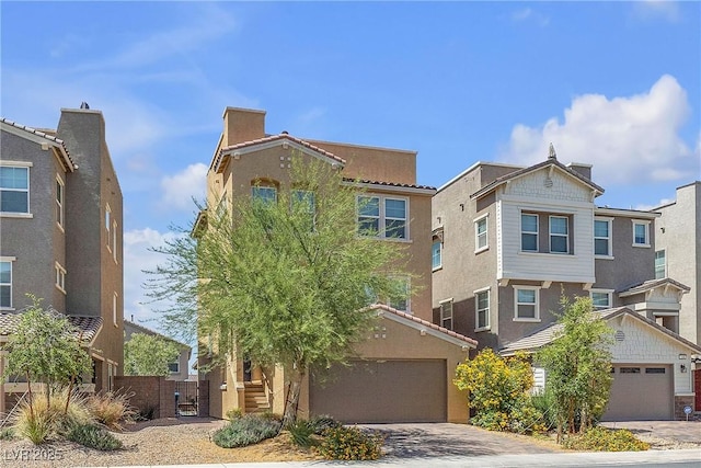 156 Campbelltown Ave, Henderson, NV 89015 - townhome / multi-family property with a garage, stucco siding, and driveway
