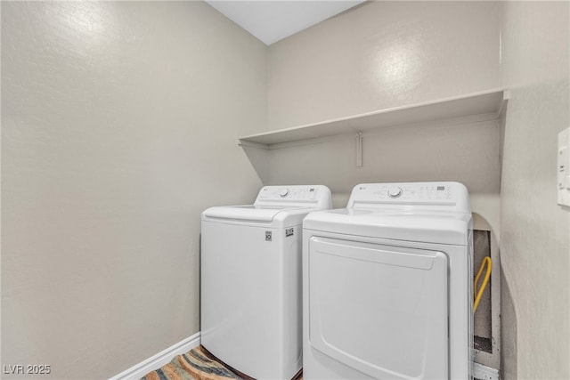 156 Campbelltown Ave, Henderson, NV 89015 - laundry area featuring washing machine and dryer, baseboards, and a textured wall