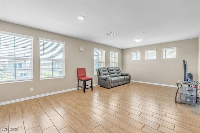 156 Campbelltown Ave, Henderson, NV 89015 - living area featuring plenty of natural light, light wood-style flooring, and baseboards
