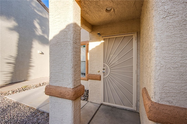 320 Ellen Marie Dr, Las Vegas, NV 89110 - doorway to property with stucco siding