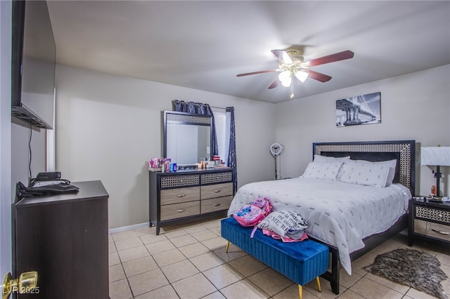 320 Ellen Marie Dr, Las Vegas, NV 89110 - bedroom with light tile patterned floors, ceiling fan, and baseboards