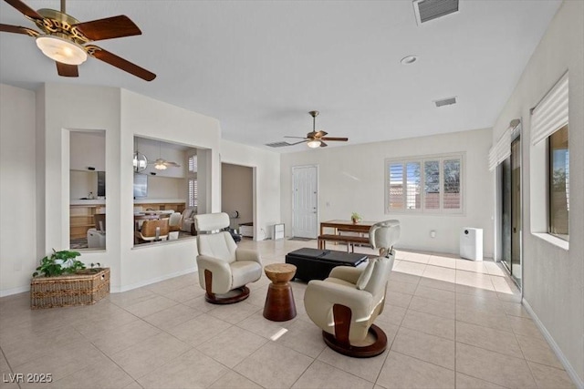 835 Market Crest Dr, Las Vegas, NV 89110 - living area featuring a ceiling fan, light tile patterned floors, and baseboards
