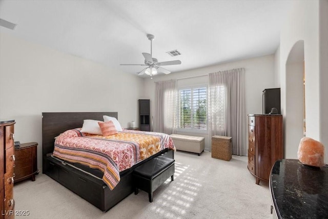 835 Market Crest Dr, Las Vegas, NV 89110 - bedroom featuring light carpet, arched walkways, and a ceiling fan
