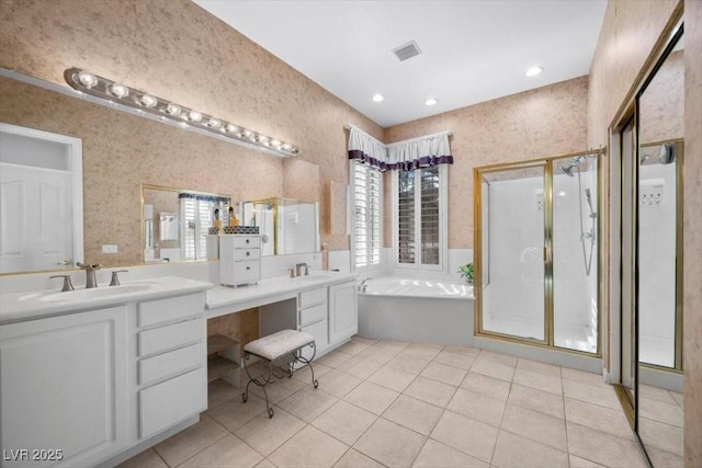 835 Market Crest Dr, Las Vegas, NV 89110 - bathroom featuring a bath, double vanity, tile patterned flooring, a stall shower, and wallpapered walls