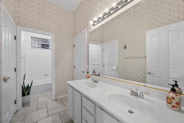 835 Market Crest Dr, Las Vegas, NV 89110 - bathroom featuring double vanity, wallpapered walls, and baseboards
