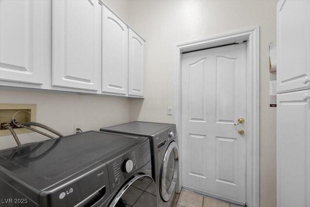 835 Market Crest Dr, Las Vegas, NV 89110 - laundry area with cabinet space, washing machine and clothes dryer, and light tile patterned flooring