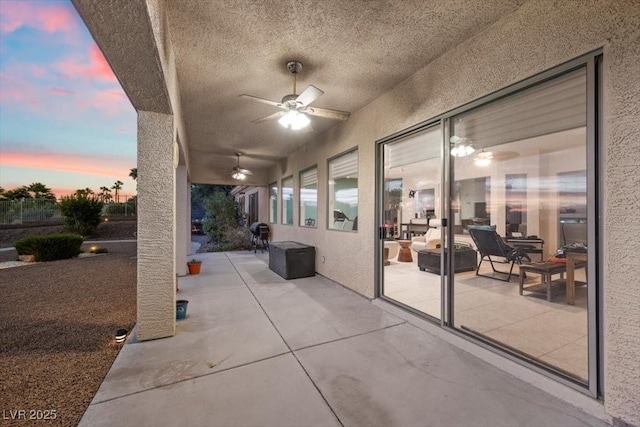 835 Market Crest Dr, Las Vegas, NV 89110 - patio terrace at dusk with a ceiling fan and a patio area