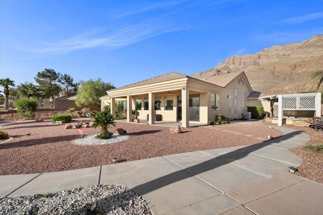 835 Market Crest Dr, Las Vegas, NV 89110 - back of house featuring a patio, a mountain view, and stucco siding