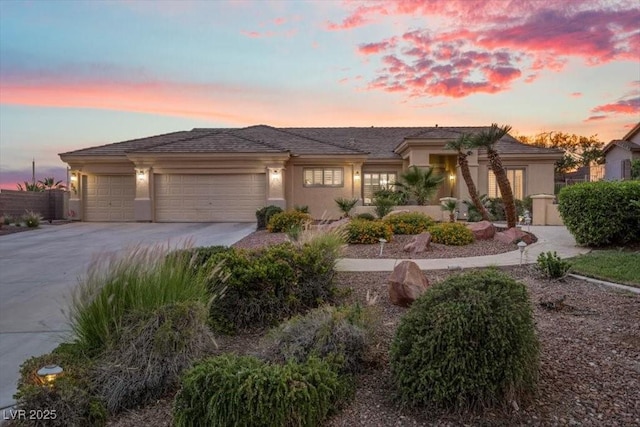 835 Market Crest Dr, Las Vegas, NV 89110 - prairie-style house with a garage, concrete driveway, and stucco siding