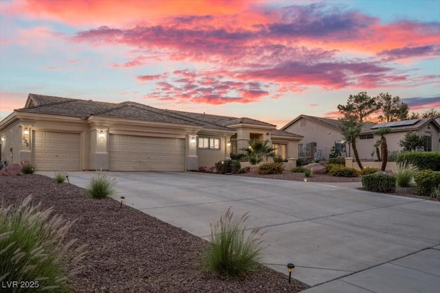 835 Market Crest Dr, Las Vegas, NV 89110 - view of front of house with an attached garage, driveway, and stucco siding