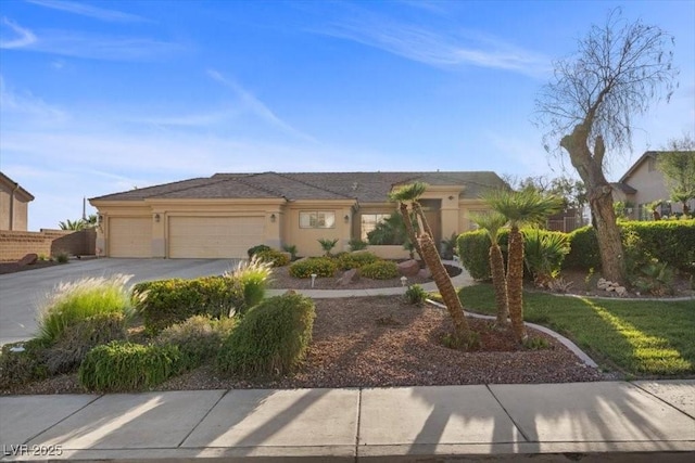 835 Market Crest Dr, Las Vegas, NV 89110 - view of front of house with driveway, an attached garage, and stucco siding
