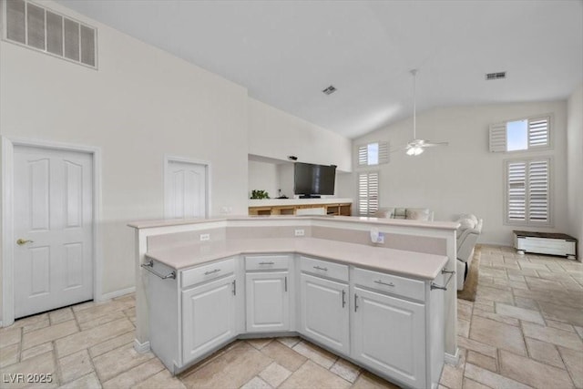 835 Market Crest Dr, Las Vegas, NV 89110 - kitchen featuring open floor plan, stone tile floors, ceiling fan, light countertops, and high vaulted ceiling