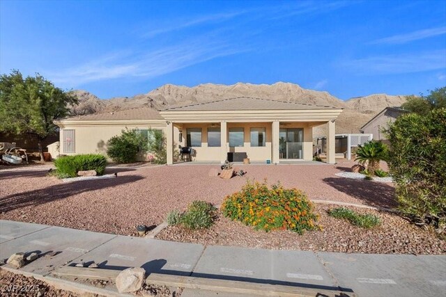 835 Market Crest Dr, Las Vegas, NV 89110 - back of house featuring a mountain view and stucco siding