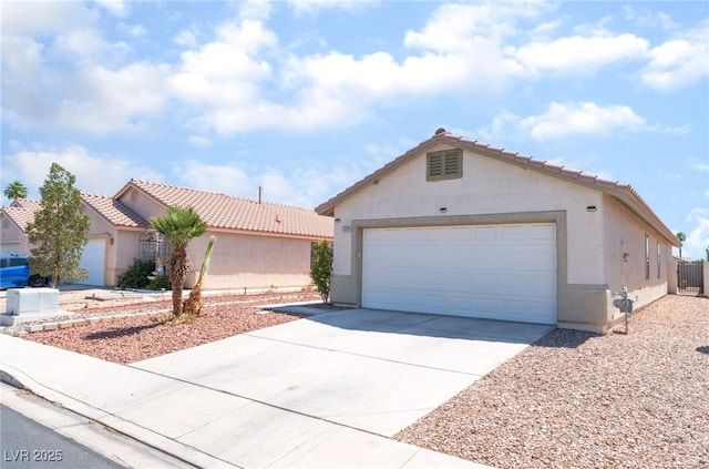 5524 La Pelusa St, North Las Vegas, NV 89031 - view of front of property featuring stucco siding, a tiled roof, concrete driveway, and a garage