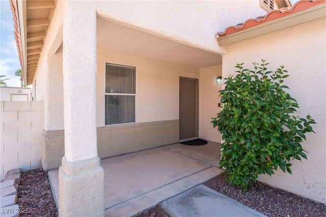 5524 La Pelusa St, North Las Vegas, NV 89031 - entrance to property featuring stucco siding and a patio area