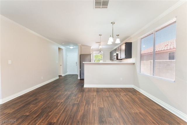 5524 La Pelusa St, North Las Vegas, NV 89031 - unfurnished living room with crown molding, baseboards, and dark wood finished floors