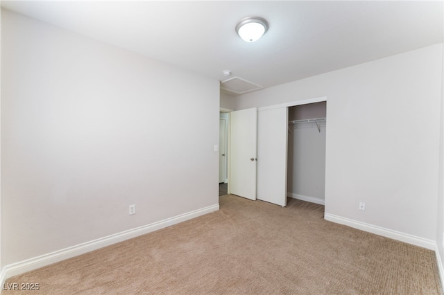 5524 La Pelusa St, North Las Vegas, NV 89031 - unfurnished bedroom with light carpet, a closet, baseboards, and attic access