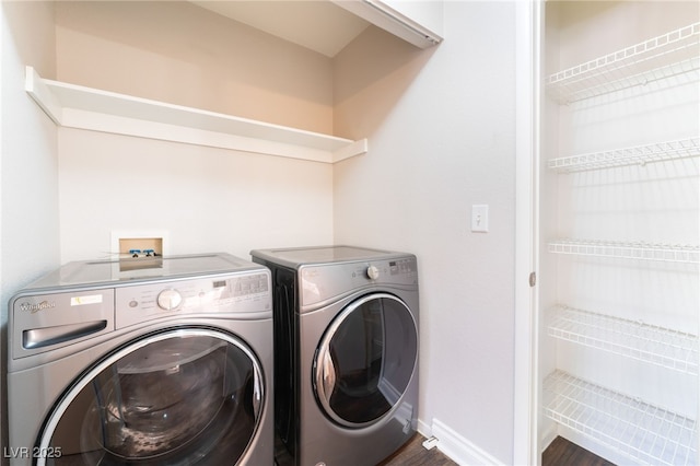 5524 La Pelusa St, North Las Vegas, NV 89031 - laundry room with separate washer and dryer, dark wood-style floors, and baseboards