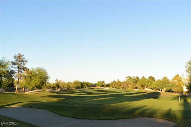 5041 Portraits Pl, Las Vegas, NV 89149 - view of home's community with view of golf course, a lawn, and view of scattered trees