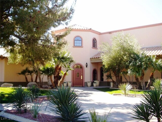 5041 Portraits Pl, Las Vegas, NV 89149 - mediterranean / spanish house with stucco siding and a tile roof