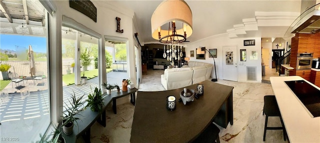 5041 Portraits Pl, Las Vegas, NV 89149 - dining area with a chandelier, light marble finish floors, and lofted ceiling