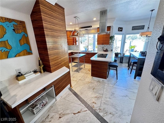 5041 Portraits Pl, Las Vegas, NV 89149 - kitchen featuring modern cabinets, island range hood, tasteful backsplash, brown cabinetry, and light countertops