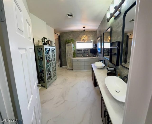 5041 Portraits Pl, Las Vegas, NV 89149 - bathroom featuring vanity and marble look tile flooring
