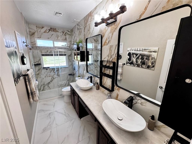 5041 Portraits Pl, Las Vegas, NV 89149 - full bath featuring a marble finish shower, marble finish floors, toilet, and double vanity