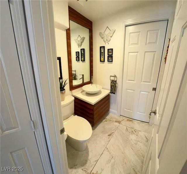 5041 Portraits Pl, Las Vegas, NV 89149 - bathroom featuring marble finish floors, vanity, and toilet