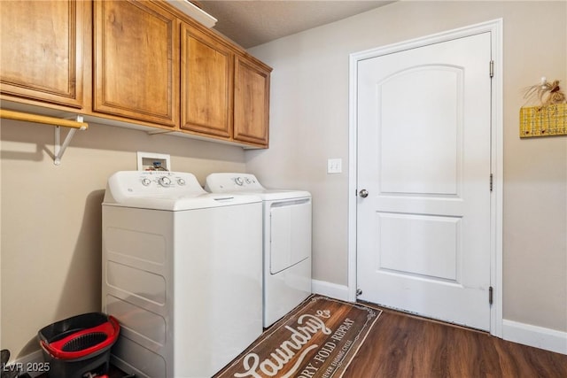 574 Desert Tortoise Way, Mesquite, NV 89027 - washroom with separate washer and dryer, cabinet space, dark wood-style flooring, and baseboards