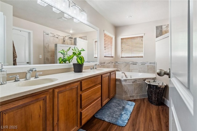 574 Desert Tortoise Way, Mesquite, NV 89027 - full bathroom with a bath, wood finished floors, and double vanity